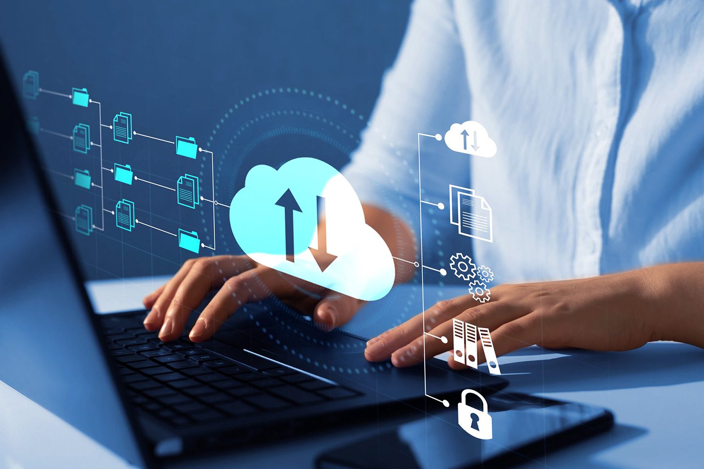 Hands typing on a laptop with cloud computing and security icons.