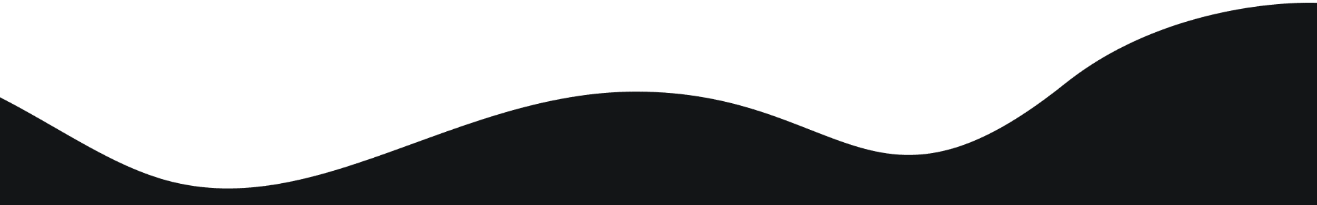 A dark silhouette of a curved shape against a greenish background.